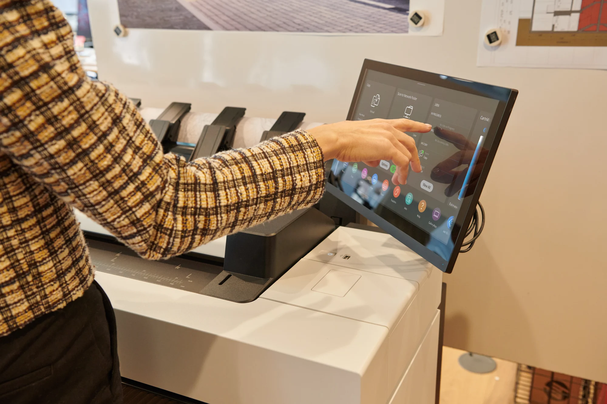 Engineering team collecting A1 construction drawings from the HP DesignJet XL 3800 integrated 100-page stacker